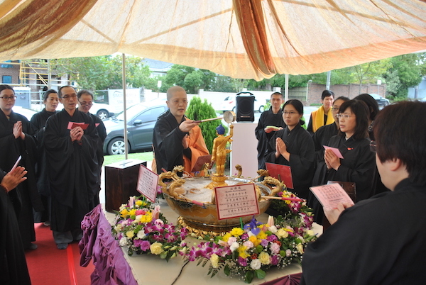 The Abbess bathing the little Buddha