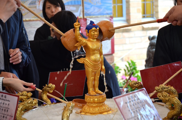 Bathing the little Buddha